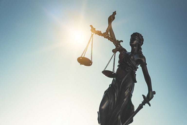 Photo ID: B09. The Statue of Justice - lady justice on sky background. Justice system concept