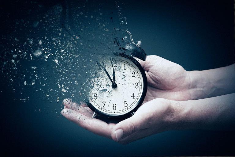 Photo ID: C03. Concept of passing away, the clock breaks down into pieces.