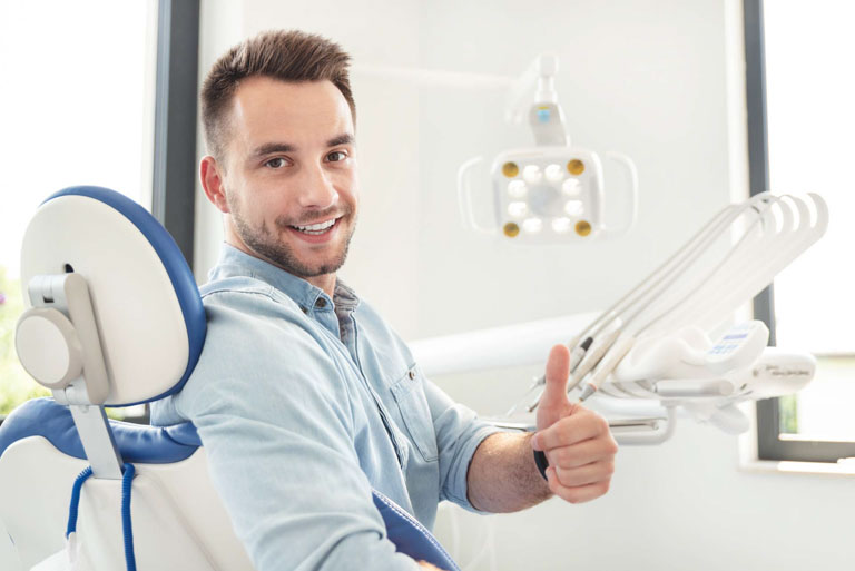 Photo ID: H03. Man with perfect smile at the dentist