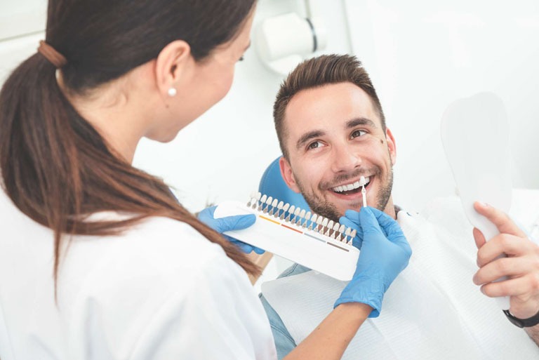 Photo ID: H04. Handsome young man in stomatology clinic with female dentist