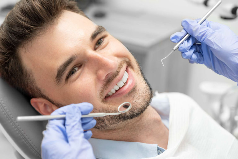 Photo ID: H08. Man having teeth examined at dentists. Dental care