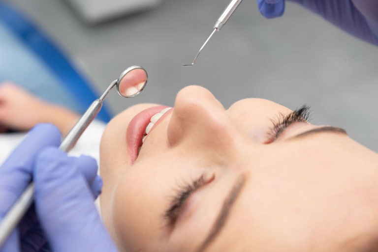 Photo ID: H09. Woman having teeth examined at dentists