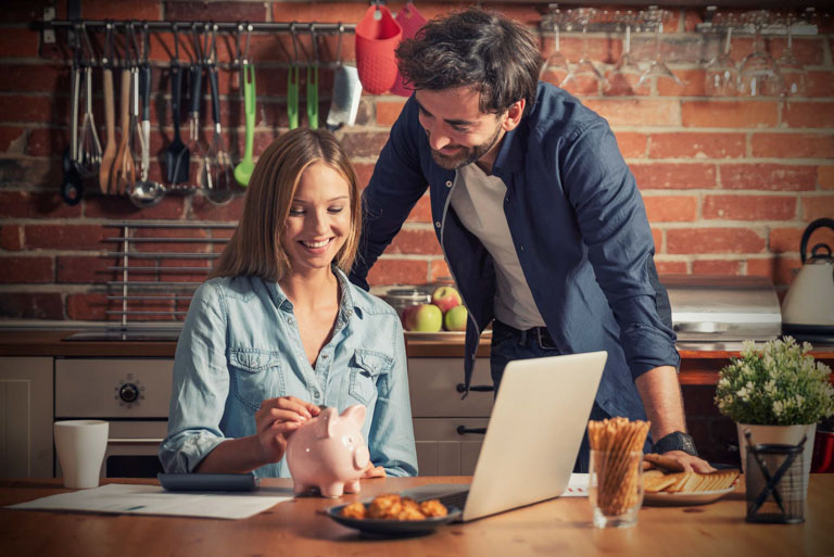 Photo ID: L05. Young couple in savings and home budget concept.