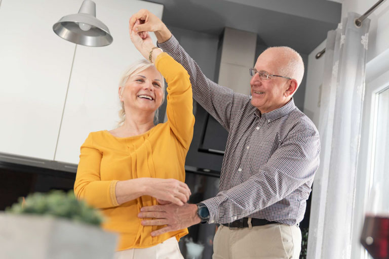 Photo ID: L09. Seniors dancing at home, happy retirement, happy senior couple at home