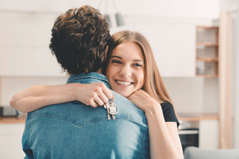 Photo ID: L16. Couple bought their apartment, they hold the keys to the house in their hands