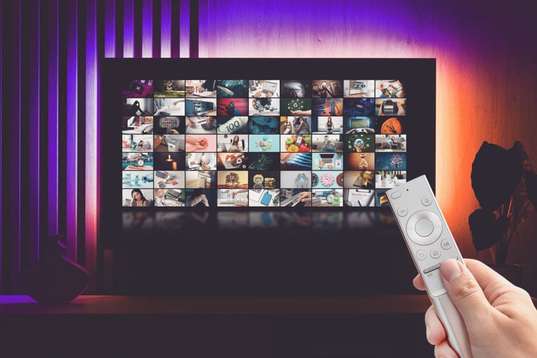 Photo ID: T11. TV multimedia streaming concept with remote control and images composition